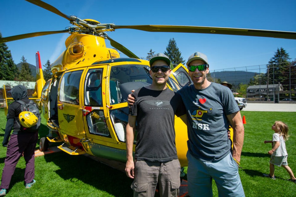 North Shore Rescue team leader Mike Danks (right) and Talon Helicopters pilot Jarrett Lunn debut the newly acquired Airbus AS365N3 Dauphin on Saturday at the outdoor safety fair in North Vancouver. Lunn has been flying rescue missions with NSR for more than a decade. | Nick Laba / North Shore News 