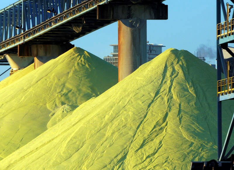Sulfur piles outside Vancouver Wharves port terminal near the Lions Gate Bridge in North Vancouver in 2017. | Mike Wakefield / North Shore News 