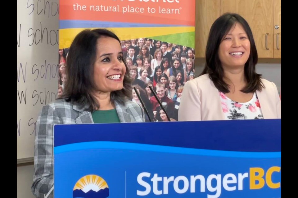Rachna Singh, minister of education and child care, with North Vancouver-Lonsdale MLA Bowinn Ma, announce on Friday that a new $64 million elementary school will be built on the site of the former Cloverley Elementary in North Vancouver. | Jane Seyd / North Shore News 
