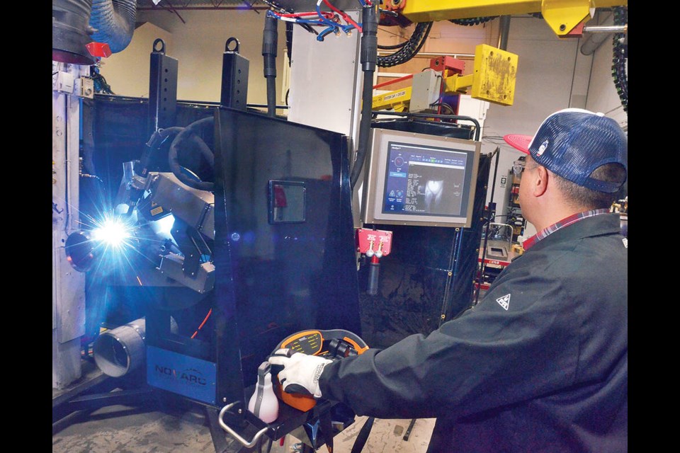 Ringo Gonzalez, director of welding innovation at North Vancouver's Novarc Technologies, conducts test welds of robotic welding machines. | Paul McGrath / North Shore News 