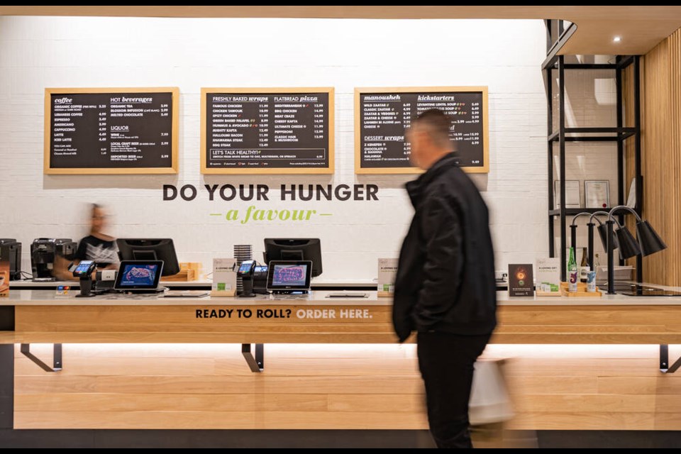 A customer approaches the counter at Zaatar W Zeit's downtown Vancouver location. A location at Park Royal in West Vancouver is due to open soon. | Zaatar W Zeit 
