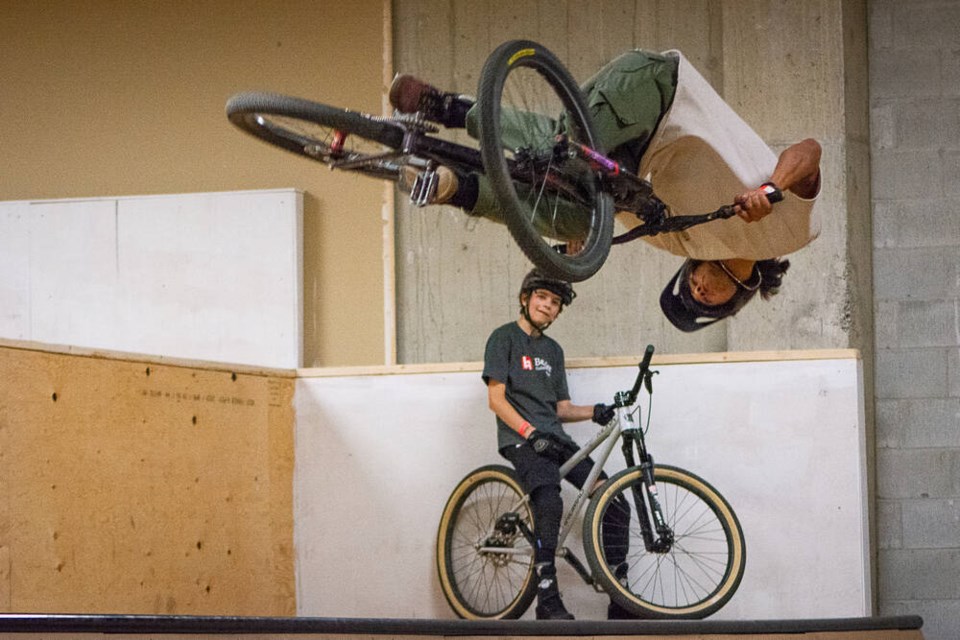 Anthony Gregory attempts a rotation trick in the half pipe, watched by Blake Stewart, July 4, 2023. | Nick Laba / North Shore News 