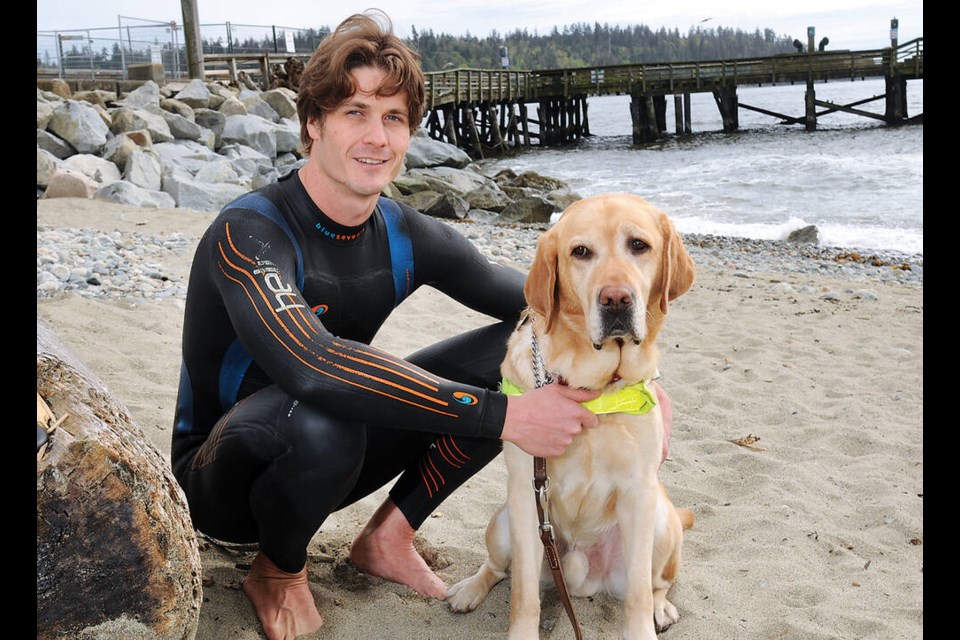 West Vancouver’s Scott Rees, who is blind, prepares for a swim across the Strait of Georgia to raise money for the non-profit group that gave him his guide dog Caleb. Rees completed the swim on Sunday, July 23. | Paul McGrath / North Shore News 