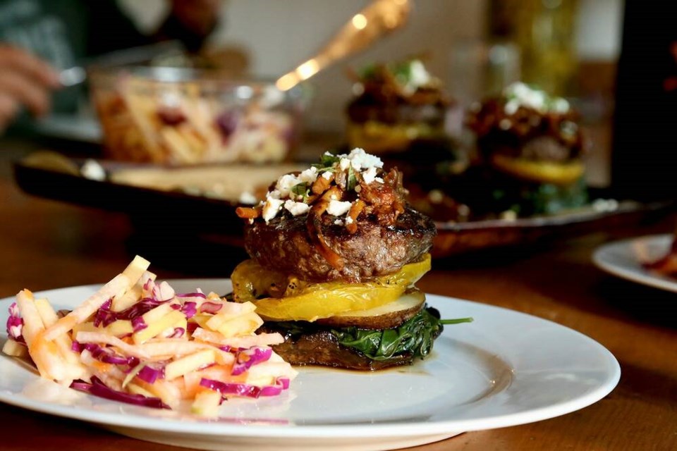 Regenerative bison and garden greens burger on a portobello cap bun, with summer slaw. | Laura Marie Neubert 
