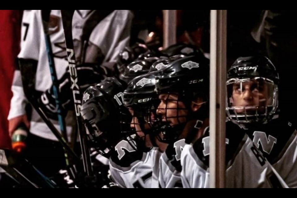 Wolf Pack players sit on the bench during a game at Harry Jerome Arena in North Vancouver. | North Van Wolf Pack 