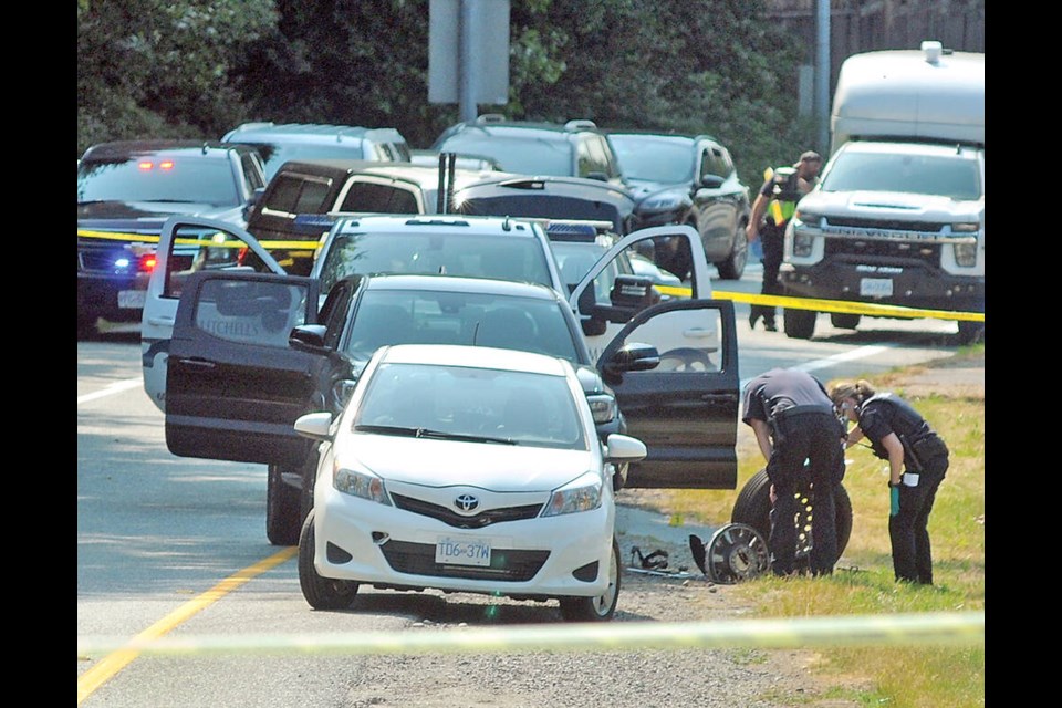 West Vancouver police and the Independent Investigations Office inspect an area near Highway 1 after an impaired driving complaint ended in "an exchange of gunfire," early in the morning on June 26, 2023. | Paul McGrath / North Shore News files