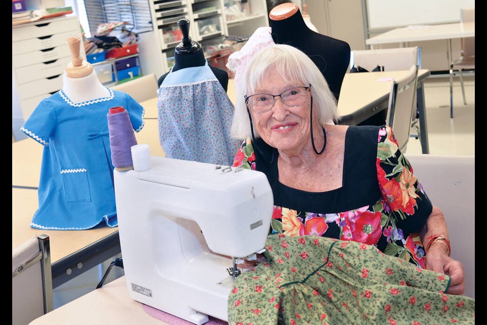 Gerda Swift, 94, was a dressmaker who created glamorous gowns throughout the 1950s and 1960s in West Vancouver. Today, she is still sewing and creating children’s outfits with the Silver Habour Seniors Centre in North Vancouver. | Paul McGrath, North Shore News 