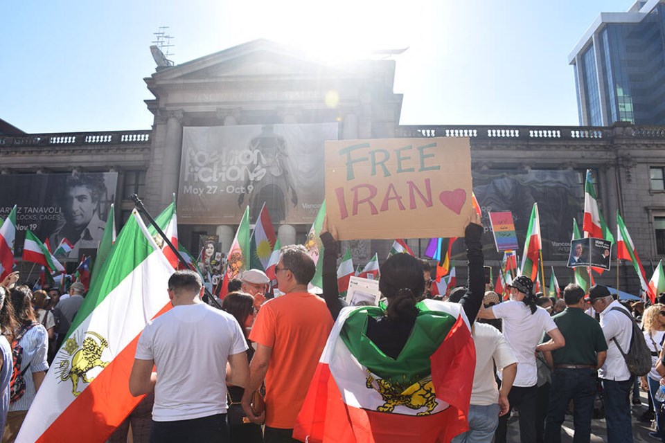 Protestors gather at Vancouver Art Gallery Saturday, Sept. 16 to mark the one-year anniversary of the Women, Life, Freedom movement in Iran. | Hamid Jafari 