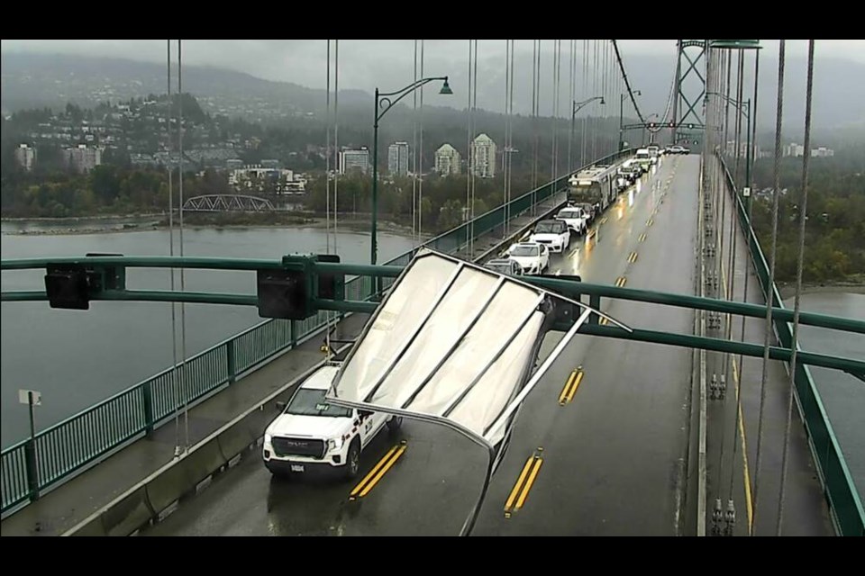 A large metal object that got wrapped around an overhead section of the Lions Gate Bridge Monday afternoon. | DriveBC