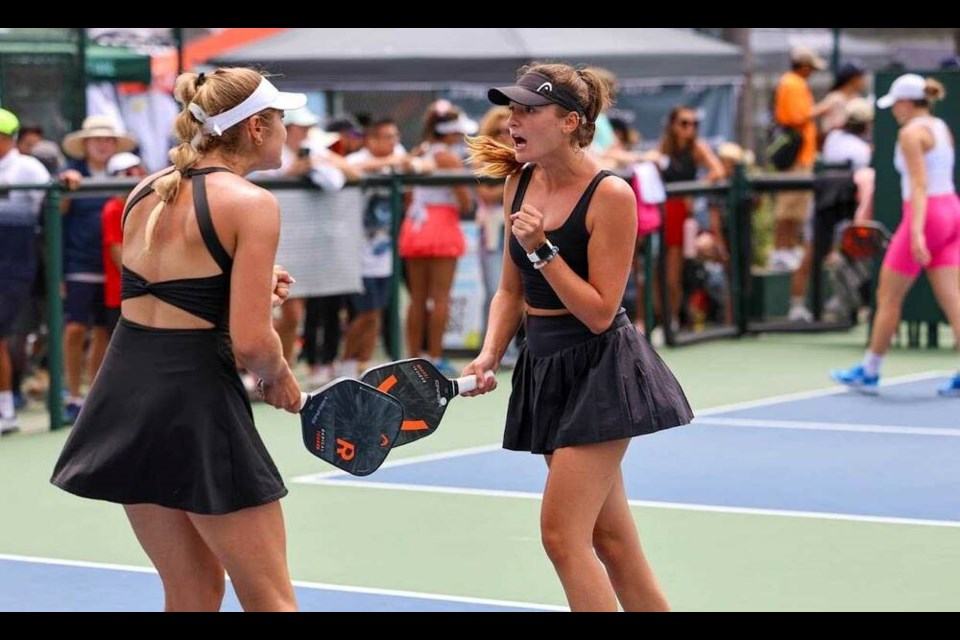 Alex and Angie Walker pump their fists in celebration at the APP Newport Beach Open in California at the end of June. | Courtesy of Alex Walker 