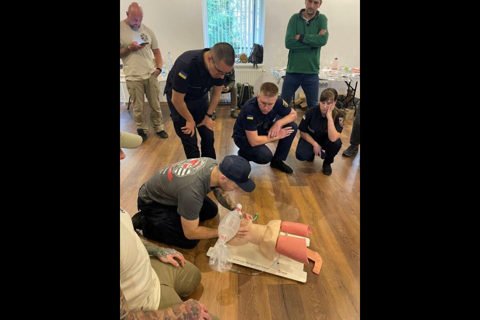 Jared Reynolds (wearing cap) was among six Canadian veterans and first responders who recently flew to Ukraine to provide specialized medic training. | Jared Reynolds 