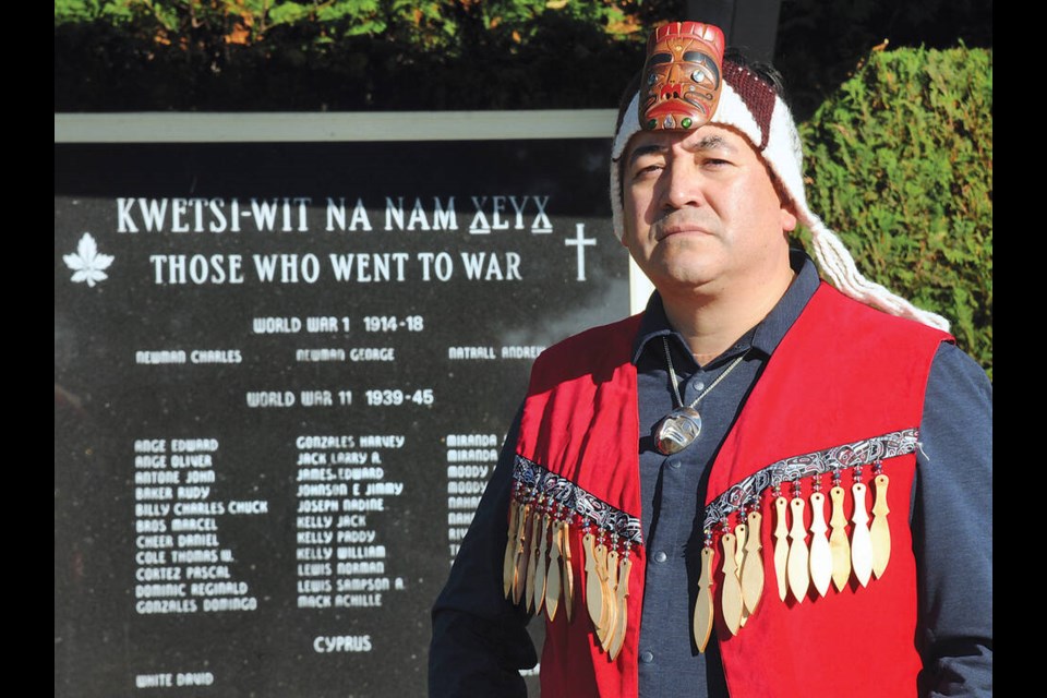 Squamish Nation’s Wilson Williams pays respect to Squamish Nation veterans at their war memorial outside St. Pauls Church. | Paul McGrath / North Shore News 