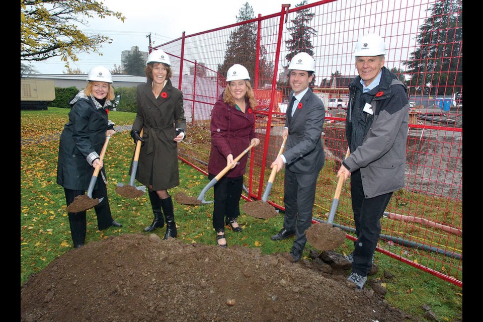 West Vancouver MLA Karin Kirkpatrick, West Vancouver councillor (and acting mayor) Linda Watt, MLA Megan Dykman, Community Development and Non-Profits Parlimentary Secretary, West Vancouver MP Patrick Weiler and Kiwanis Housing Society past president Patrick McLaughlin break ground during ceremony celebrating the start of an affordable rental housing project on West Vancouver’s Gordon Avenue Friday afternoon. | Paul McGrath / North Shore News 
