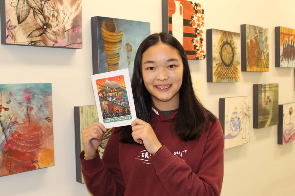 Ecole Handsworth Secondary student Lauren Yung shows off the design that won her the LGH Christmas Card Contest. Her design will be sold at Save-On-Foods stores across the North Shore. | LGH Foundation 