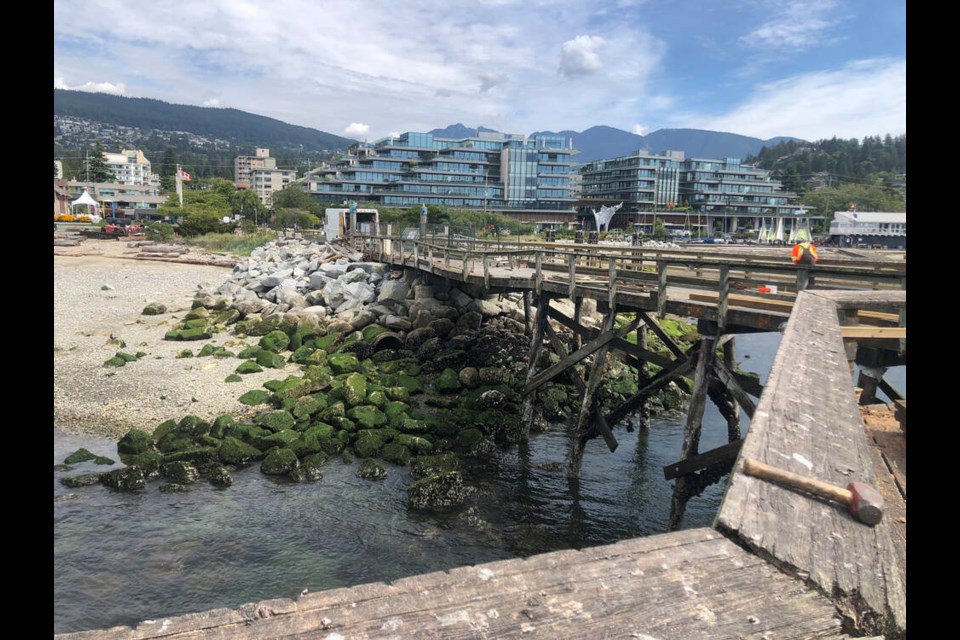 Workers repair severe damage done to West Vancouver’s Ambleside Pier following a 2022 wind storm. | District of West Vancouver 