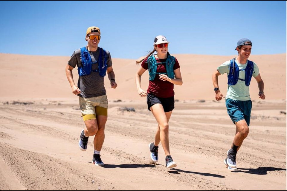 Rhiannon Henley (centre) runs across Chile’s Atacama Desert with two other Impossible2Possible youth ambassadors in November. | Kent Keeler 