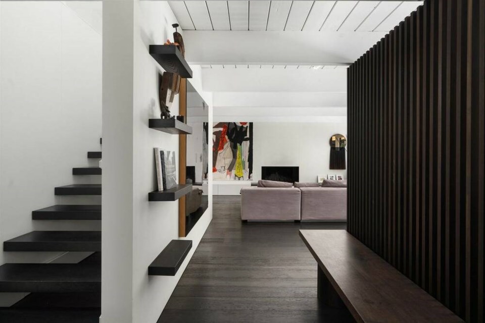 A downstairs hallway leads to a living area, or a staircase to the second storey, in a 1959 West Vancouver house originally crafted by influential builder Bob Lewis. | InFrame Real Estate / Sue Scott PREC 