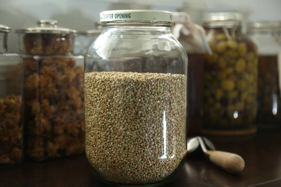 Bulk-purchased raw buckwheat, an inexpensive super food, can be stored in glass jars in a cool, dark pantry. | Laura Marie Neubert