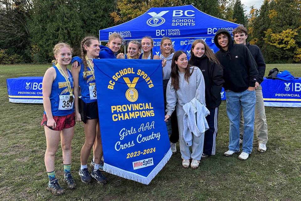 Members of the Handsworth cross-country running team celebrate a win in the senior girls AAA provincial championship race. | Drew Martin 