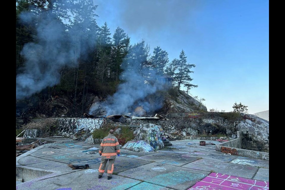 Fire crews examine the levelled wreckage of the structure on Friday, Sept. 22. | West Vancouver Fire & Rescue 