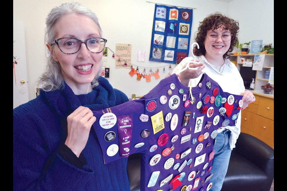 North Shore Women’s Centre executive director Michelle Dodds (left) and Sydney Dawson, NSWC fund development and communications co-ordinator, share some of the 50-year history of the centre. | Paul McGrath / North Shore News 