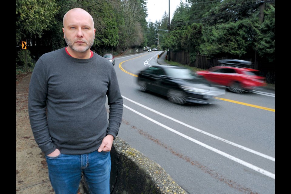 North Vancouver resident Ralph Ferens is among the neighbours concerned about vehicles losing control on this section of Capilano Road. | Paul McGrath photo / North Shore News 