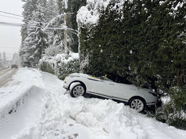 A vehicle ended up in a hedge after losing control on Capilano Road’s S-bend in the snow Jan. 17 | photo courtesy Rob Greene 