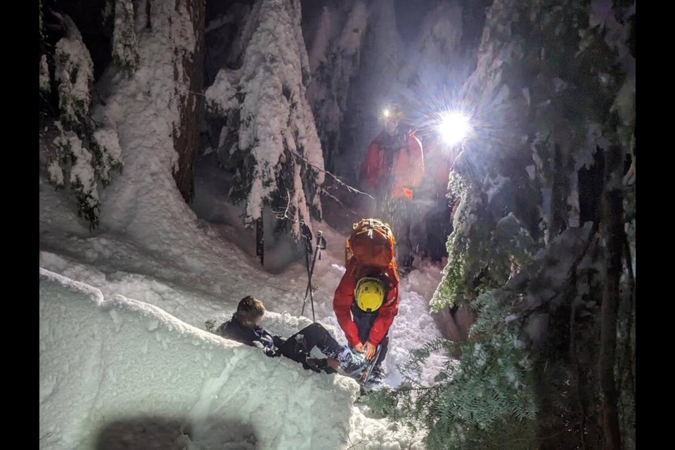 North Shore Rescue volunteers assist a snowboarder who got stuck out of bounds near Cypress Mountain Resort on Jan. 19, 2024. | North Shore Rescue 