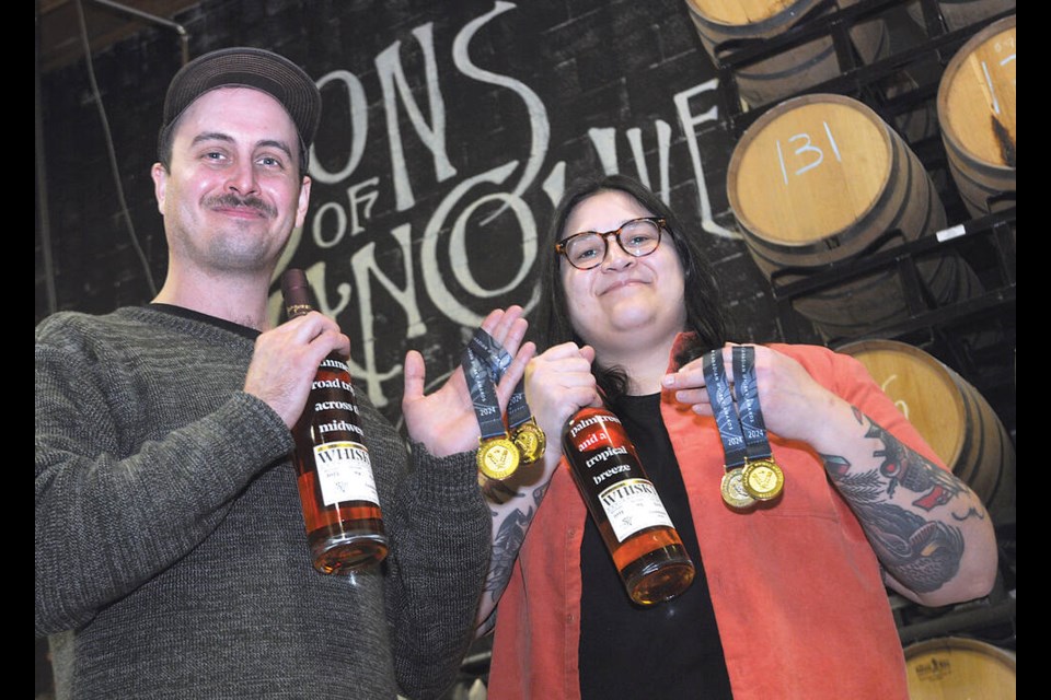 Sons of Vancouver co-owners Max Smith and Jenna Diubaldo show off their award-winning whisky. | Paul McGrath / North Shore News 