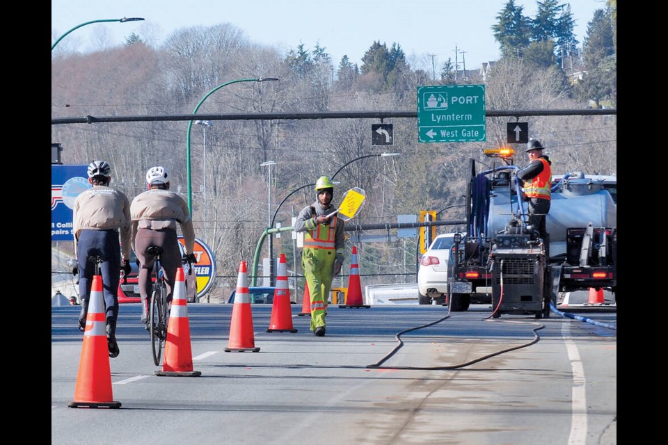 Westbound cyclists approach new bike lane construction zone on Main Street in North Vancouver. | Paul McGrath / North Shore News 