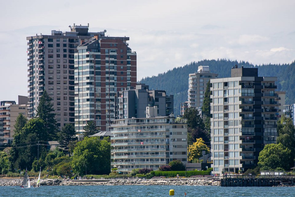 Seaside apartments in Ambleside catch the gleam of July sunshine. A packed town hall meeting Thursday night included questions and comments on a proposed local area plan. | Nick Laba / North Shore News 