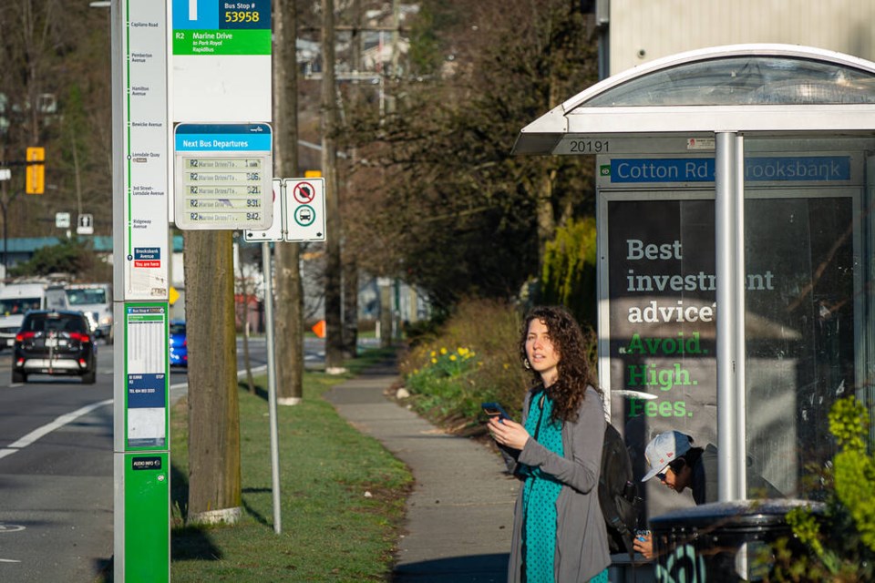 Potential passengers wait for the R2 bus on Main Street near Brooksbank Avenue in North Vancouver on Tuesday, March 19. | Nick Laba / North Shore News 