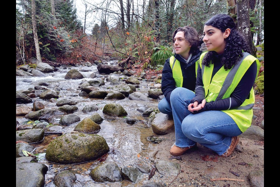 West Vancouver Secondary students Jeffery Jackson and Meha Farrokhi check McDonald Creek in West Van. The two were student leads on the 2023 West Vancouver Streamkeepers salmon spawner survey. | Paul McGrath / North Shore News 