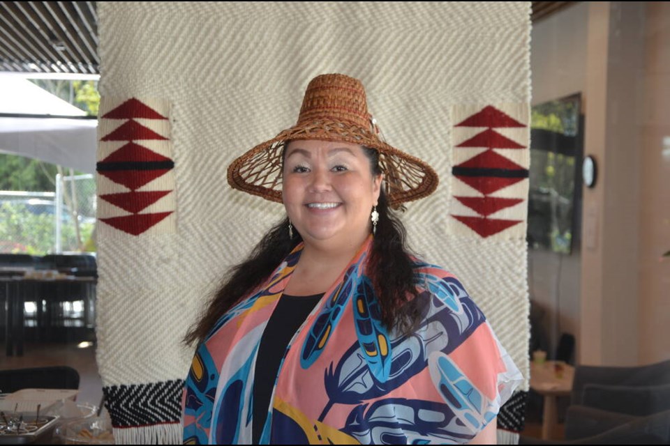 Hiy̓ám̓ Housing manager Holli Wilson takes the lead in the opening ceremony for a new Squamish Nation supportive housing building April 16. | Mina Kerr-Lazenby / North Shore News 