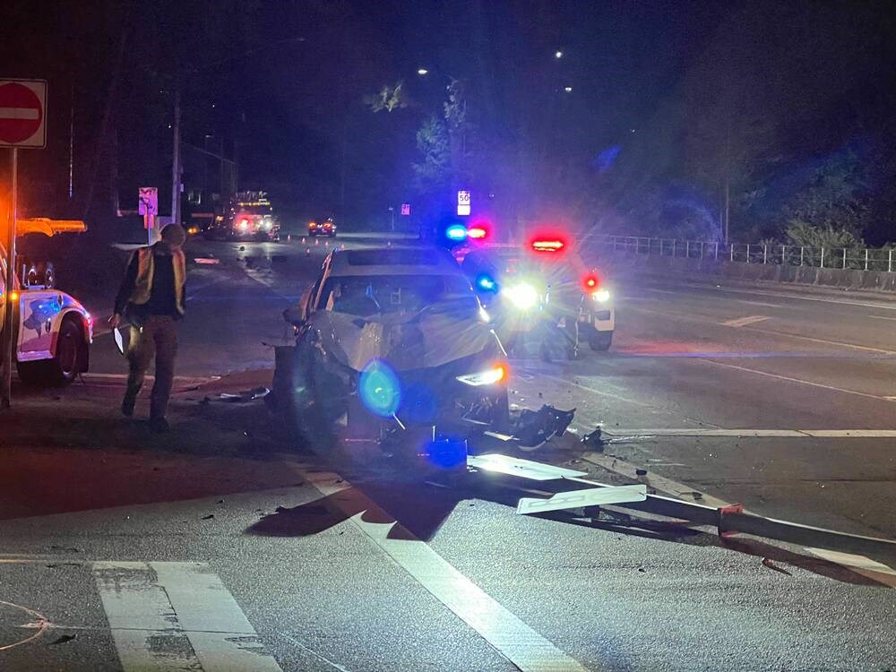 Driver collides with power pole, lamp post in early morning collision on Capilano Road