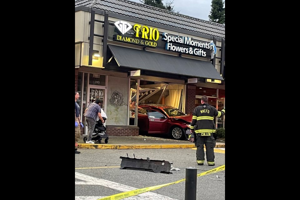 A multi-car crash in North Vancouver’s Park & Tilford shopping centre resulted in one car reversing into the shop front of a local flower shop. | Linda Madi 