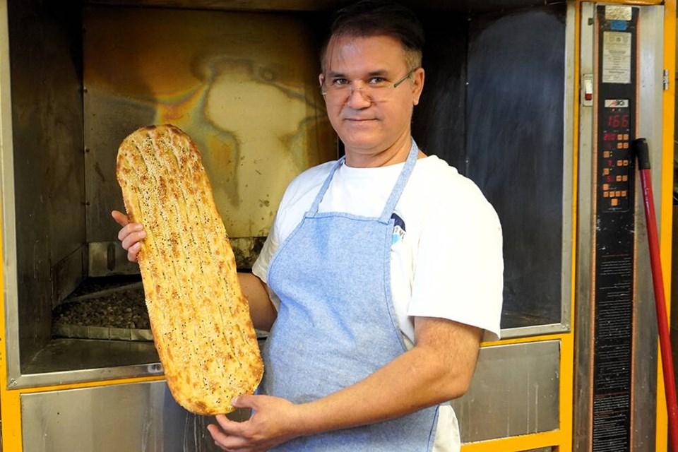 Alireza Tabrizi is the owner of Naan Tabriz in North Vancouver. The bakery specializes in barbari, shown here, and sangak bread. | Hamid Jafari / North Shore News 
