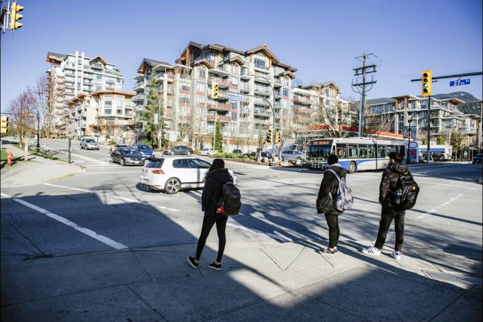 Pedestrians wait to cross the intersection at Mountain Highway and E 27th Street in North Vancouver. | District of North Vancouver 