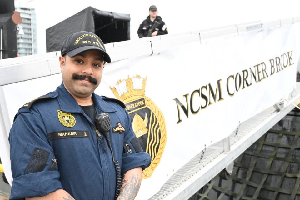 Petty Officer, First Class, Stephen Mahabir stands outside HMCS Corner Brook. | Abby Luciano / North Shore News 