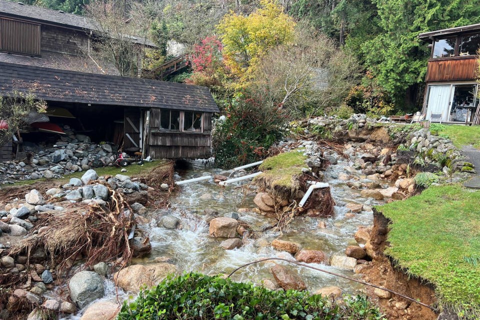 Debris flushed down during the atmospheric river storm of Oct. 18-20 sits strewn about near several Deep Cove properties. An evacuation order was issued for three homes Oct. 26 due to more debris falling from clogged creek systems above. | Pat Bell