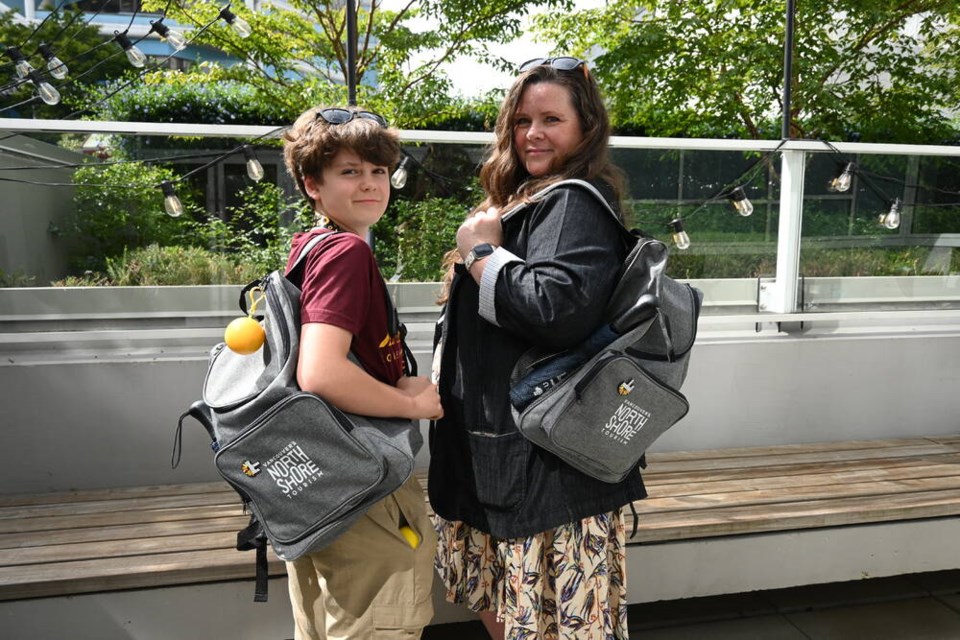 Stephanie Rose and her son Asher carry the new neurodiverse backpacks outside of the Museum of North Vancouver (MONOVA) after the launch of the new bags. | Abby Luciano / North Shore News