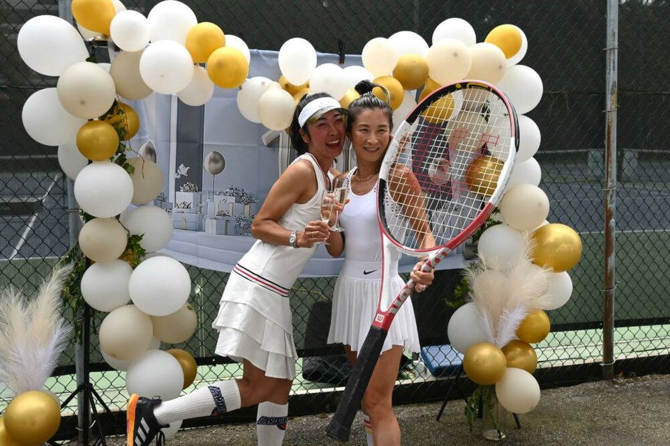 Two West Vancouver Tennis Club members smile for the camera at the photo station Saturday, June 14. | Abby Luciano / North Shore News 