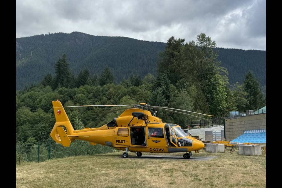 A Talon helicopter sits at North Shore Rescue's Capilano Gate base as volunteer members help a teenager who sprained her ankle hiking up St. Mark's Summit along the Howe Sound Crest Trail Sunday. | North Shore Rescue