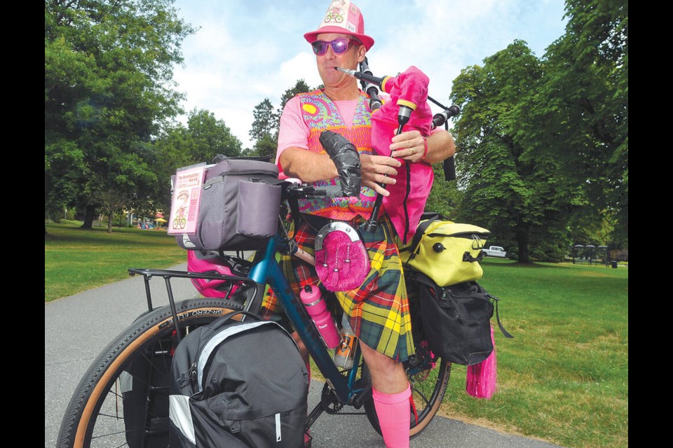 Frank Wimberley, North Vancouver’s Perambulating Pink Pied Piper, is riding across Canada to raise money for children's education in bagpipe music and literary arts. | Paul McGrath / North Shore News 