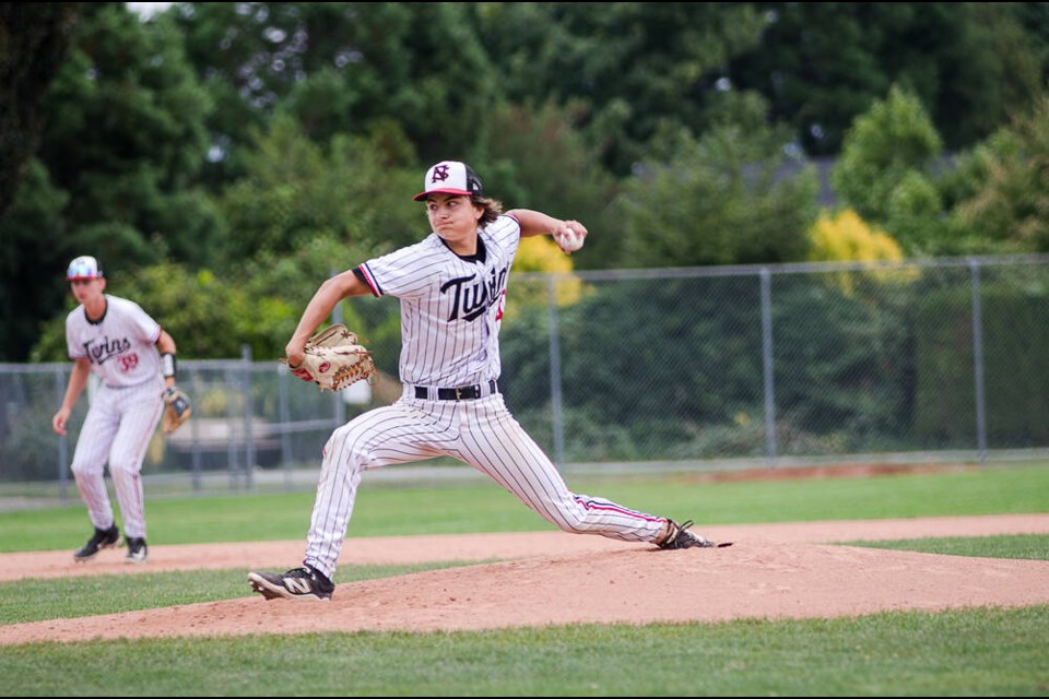 Twins pitcher Martin Cooke, 15, throws from the mound in the BCPBL provincial tournament. | Oliver Brett 