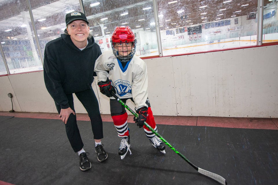 Olympic champion and PWHL Vancouver defender Ashton Bell meets summer camp trainee Gabriella Tapping, 9, at the North Shore Winter Club, Aug. 14. | Nick Laba / North Shore News 