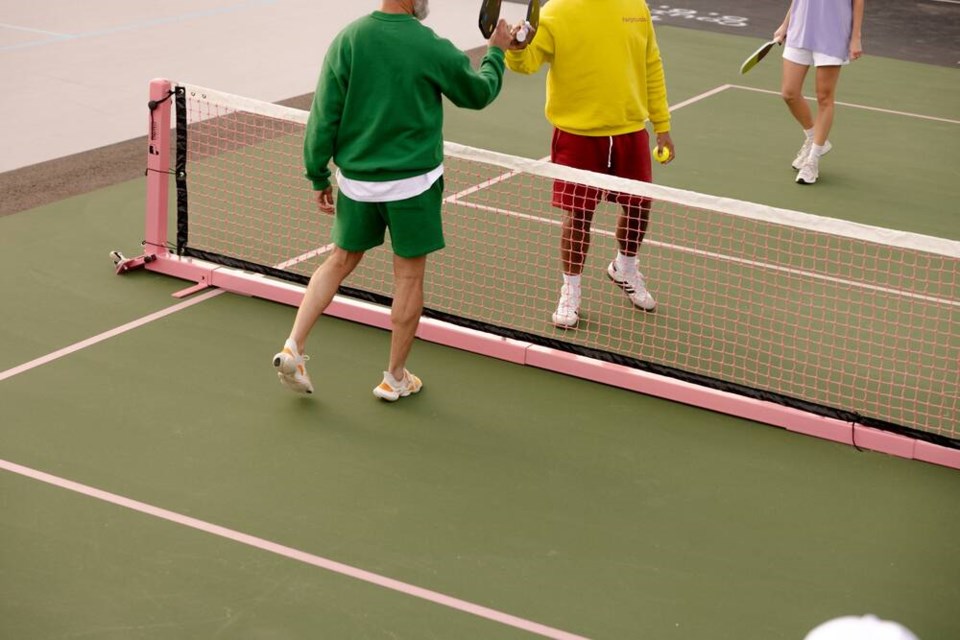 Players tap pickleball rackets at a Fairgrounds court in Ontario. The company is set to open a similar facility in the old Sears store in North Vancouver's Capilano Mall. | Fairgrounds 