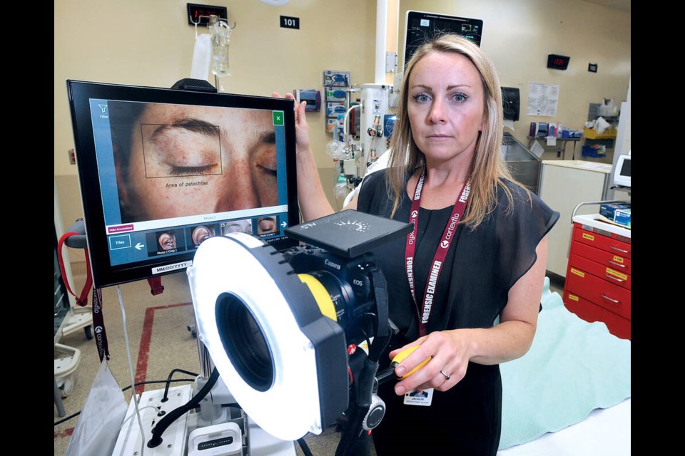 Jacquie Miller, the co-ordinator for the Forensic Nursing Services unit at Lions Gate Hospital in North Vancouver, holds the CortexFlo camera, the latest piece of tech for the specialized unit. | Paul McGrath / North Shore News 