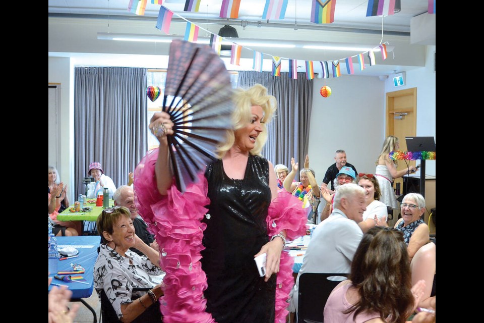 Drag queen Carlotta Curl performing and calling the bingo games at West Vancouver Memorial Library, in conjunction with the North Shore Pride Alliance. | Paul McGrath / North Shore News 
