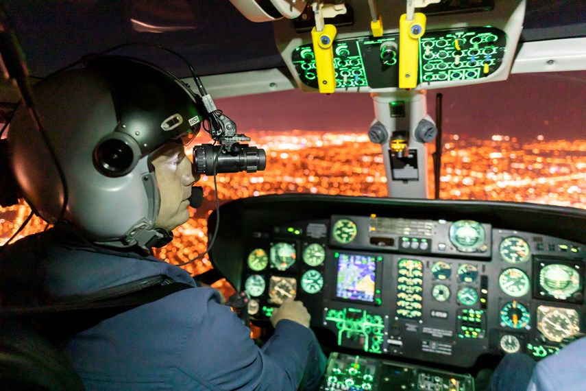 Talon Helicopter pilots Kelsey Wheeler, left, and Jarrett Lunn use NVG while flying Talon's Airbus AS365N2 Dauphin back to their base at Vancouver airport.
photo Heather Moffat